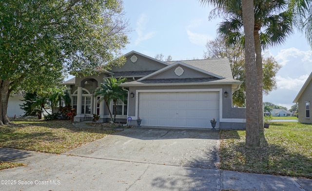 view of front facade featuring a garage and a front lawn