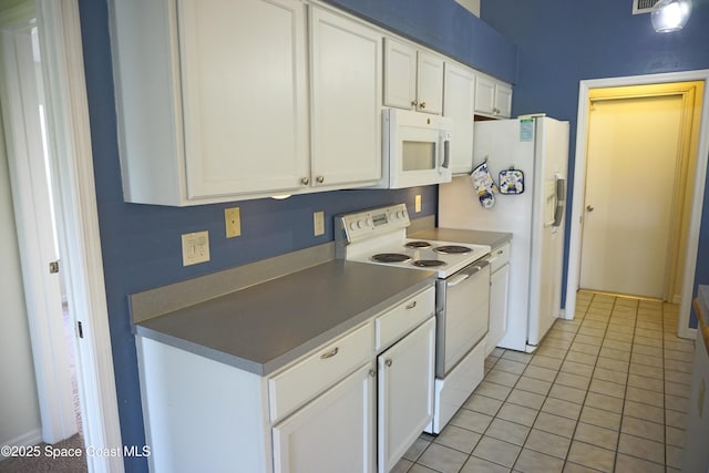 kitchen featuring white cabinetry, white appliances, and light tile patterned floors