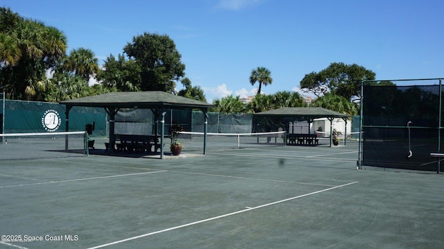 view of tennis court with a gazebo