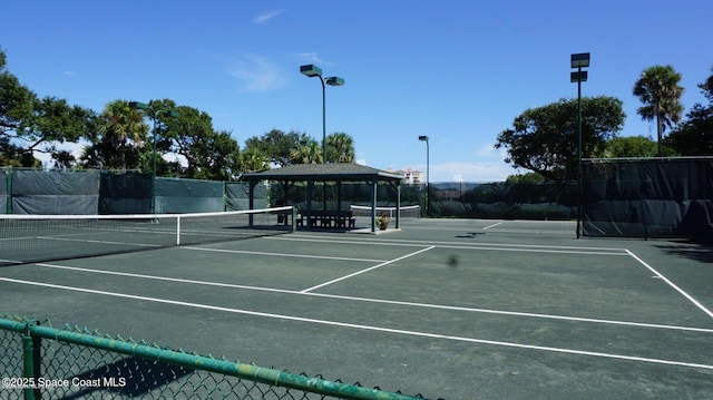 view of tennis court with a gazebo