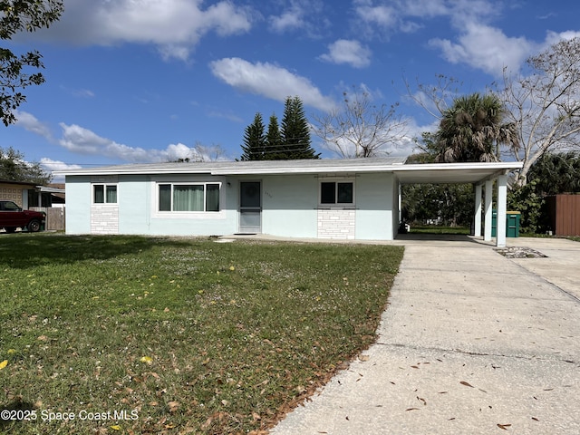 ranch-style house with a front yard and a carport