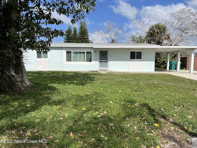 single story home featuring a carport and a front lawn