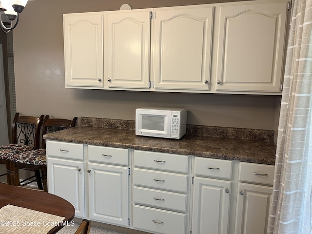 kitchen with white cabinets