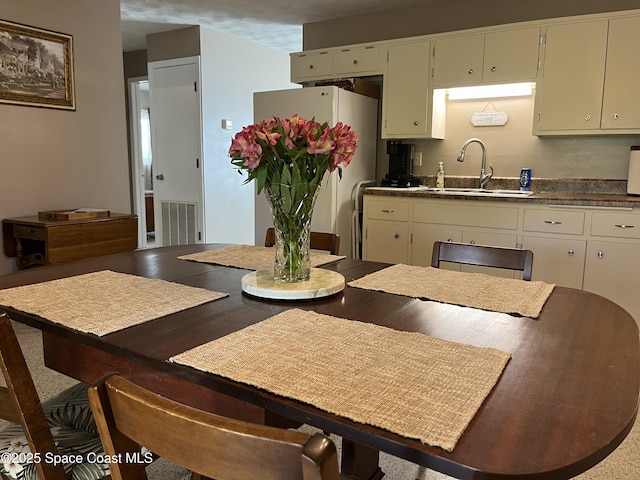 dining space featuring sink