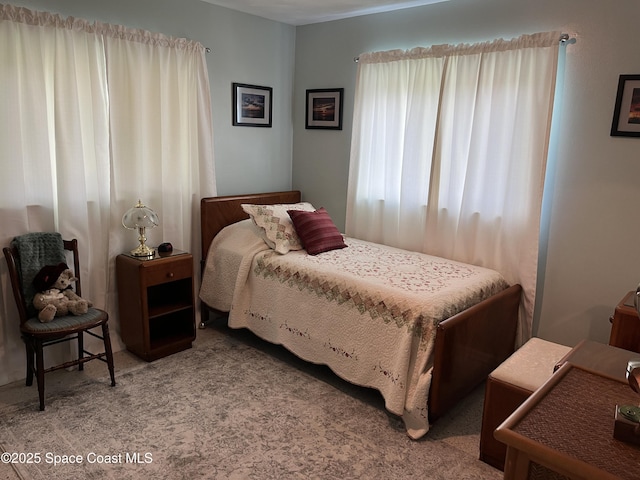 bedroom with light carpet