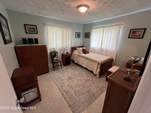 bedroom featuring a textured ceiling