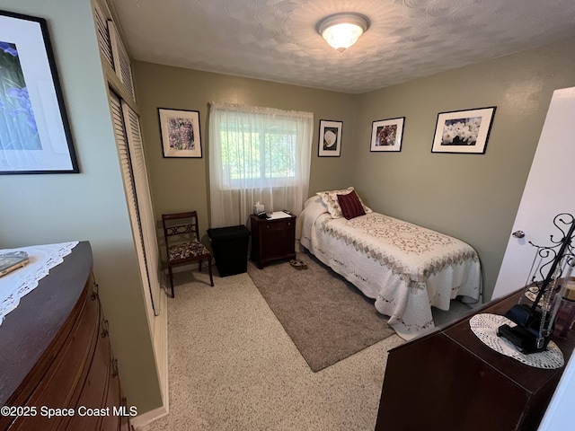 bedroom featuring a closet and a textured ceiling