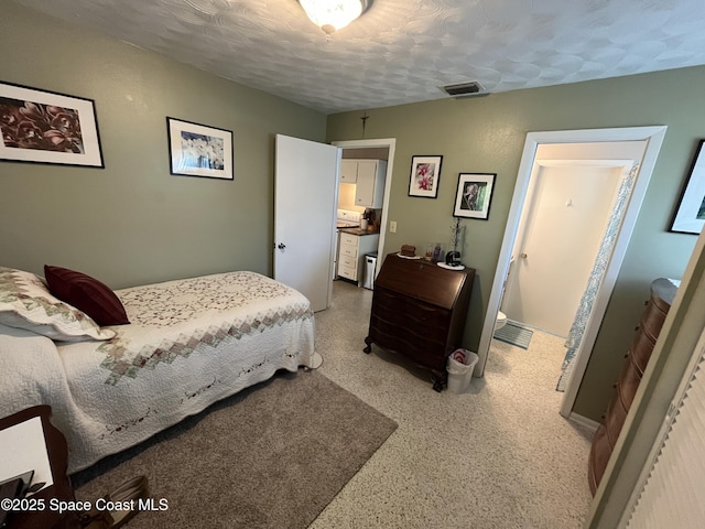 bedroom featuring a textured ceiling