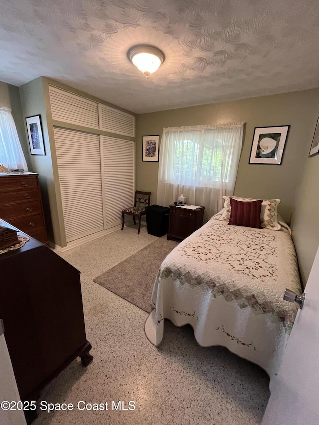 bedroom featuring a textured ceiling