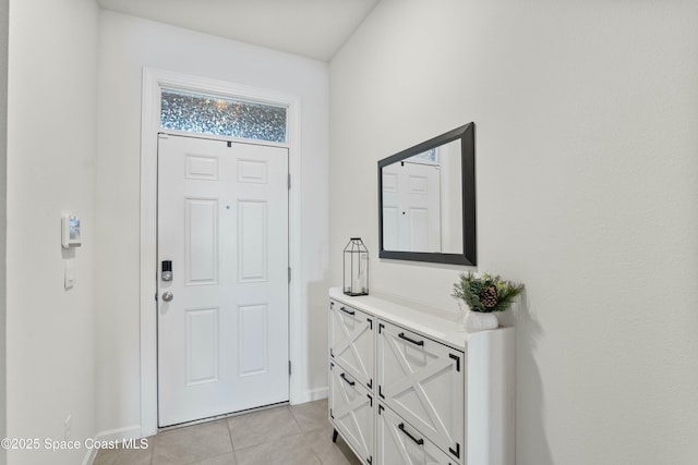 foyer with light tile patterned floors