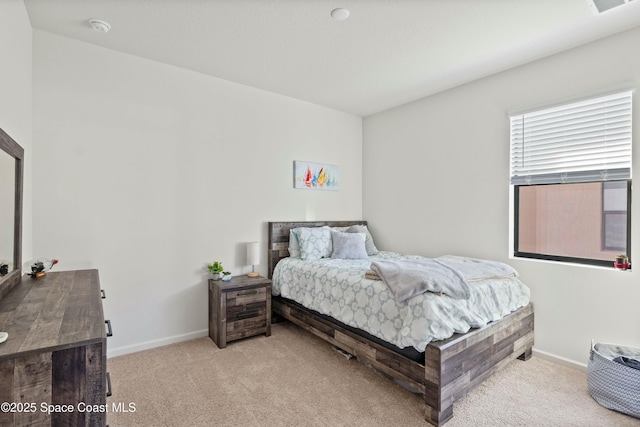 bedroom with light carpet