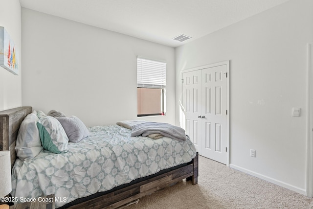 carpeted bedroom with a closet