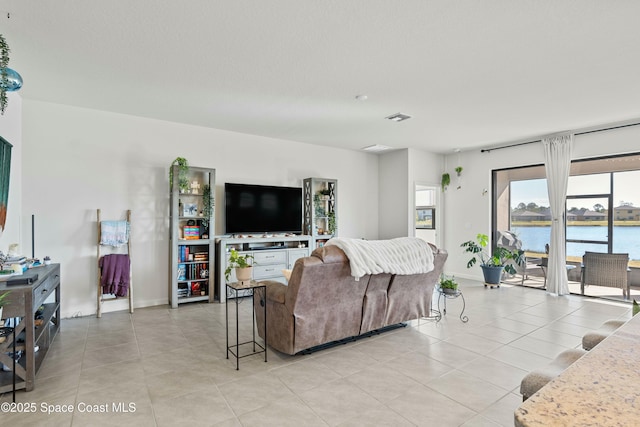 living room with light tile patterned floors