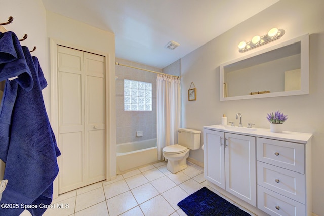 full bathroom with tile patterned flooring, vanity, shower / tub combo, and toilet