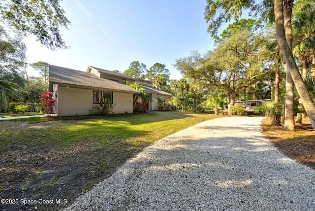 view of side of property featuring a lawn