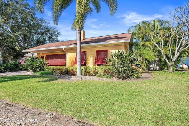 ranch-style house with a front yard