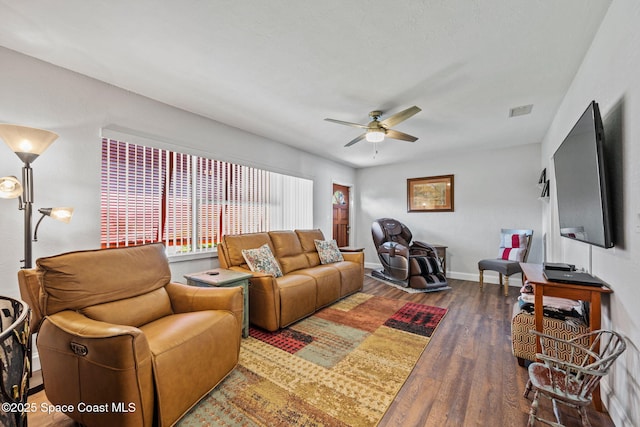 living room featuring dark hardwood / wood-style floors and ceiling fan