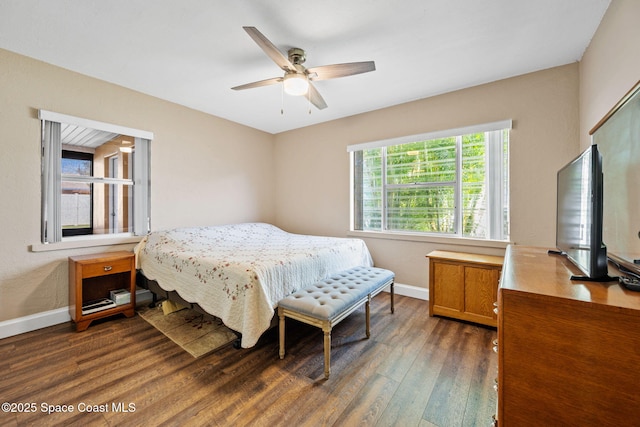 bedroom with dark hardwood / wood-style floors