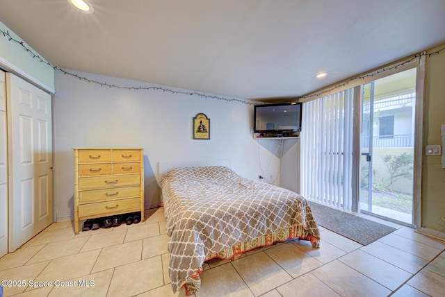 tiled bedroom with access to exterior