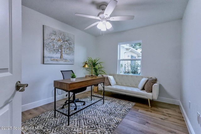 office space featuring hardwood / wood-style flooring and ceiling fan