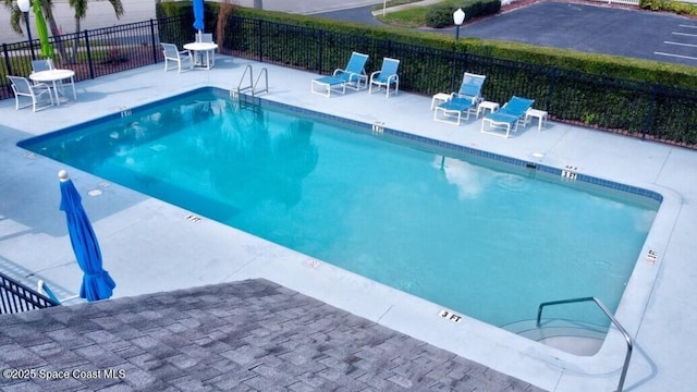 view of pool featuring a patio area