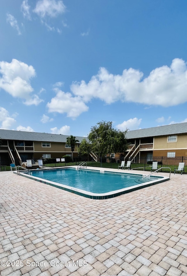 view of swimming pool featuring a patio