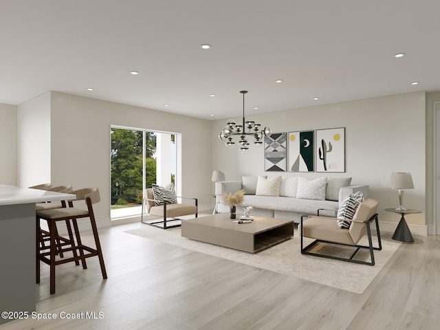 living room featuring an inviting chandelier and light hardwood / wood-style flooring