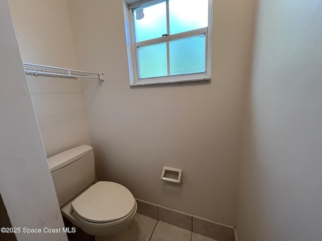 bathroom featuring tile patterned floors and toilet