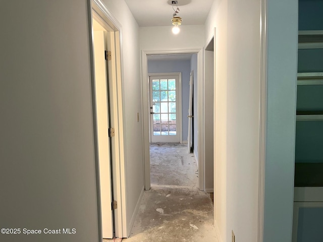 hallway featuring concrete flooring