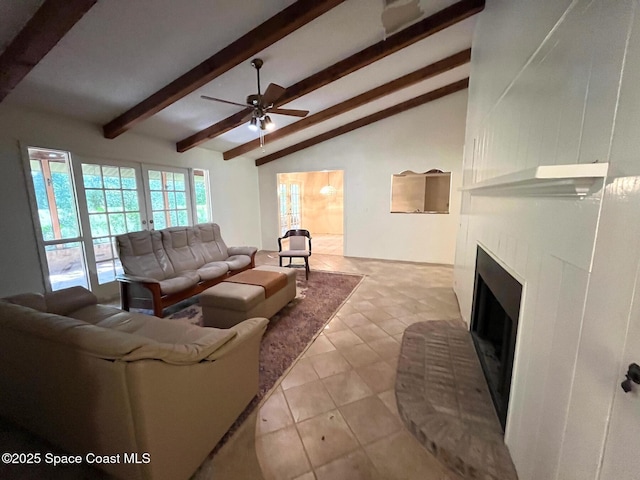 living room featuring ceiling fan, a fireplace, and lofted ceiling with beams