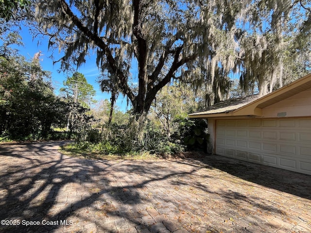 view of yard featuring a garage