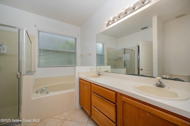 bathroom with independent shower and bath, vanity, and tile patterned floors