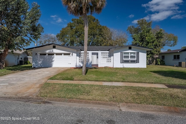 ranch-style home featuring a garage, cooling unit, and a front lawn