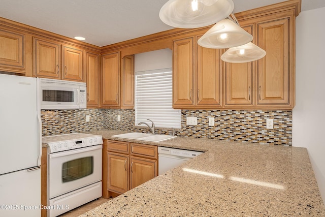 kitchen with decorative light fixtures, sink, backsplash, light stone countertops, and white appliances