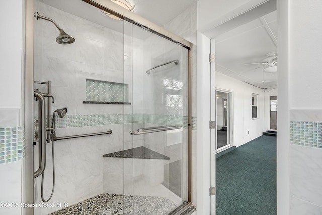 bathroom featuring an enclosed shower and ceiling fan