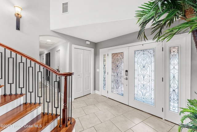 tiled entryway with french doors