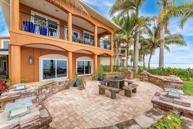 view of patio with a balcony