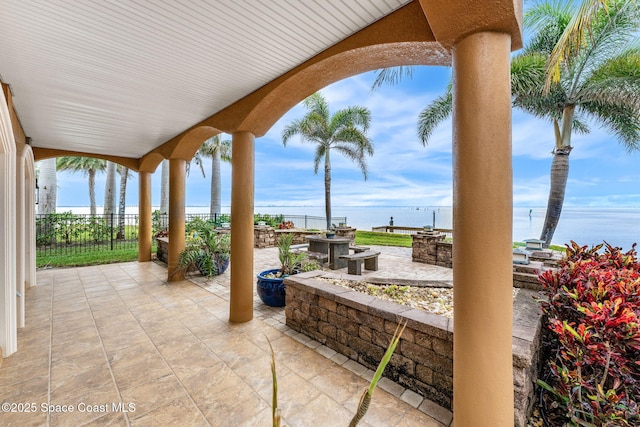 view of patio featuring a water view