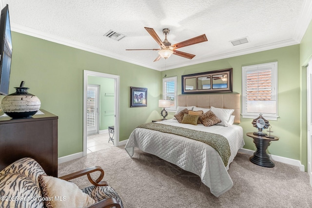 bedroom featuring light carpet, ceiling fan, crown molding, and a textured ceiling