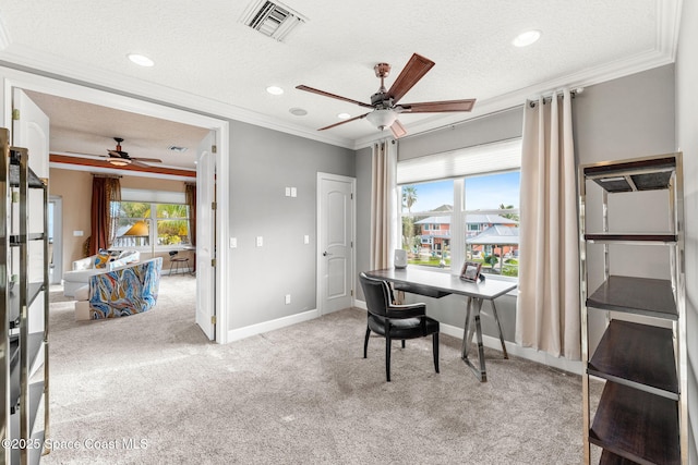 office with ceiling fan, ornamental molding, a textured ceiling, and carpet