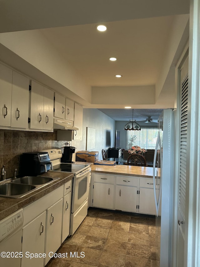 kitchen featuring white cabinetry, white appliances, sink, and backsplash