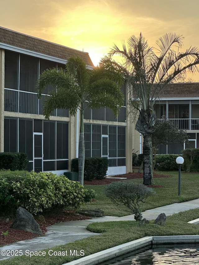 view of outdoor building at dusk