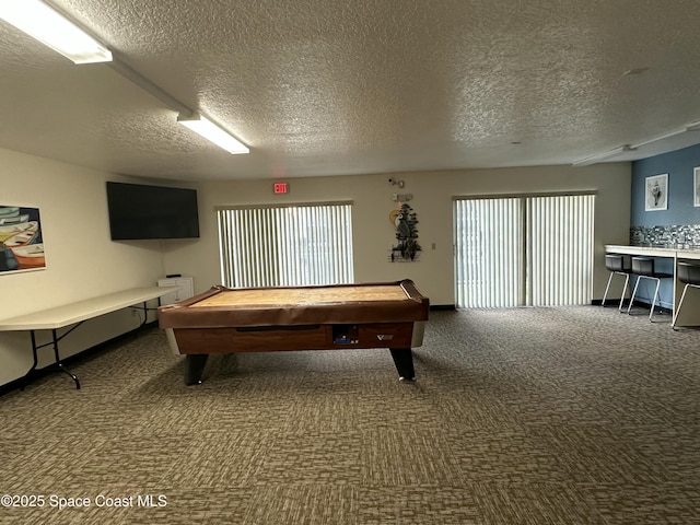 playroom with billiards, carpet, and a textured ceiling