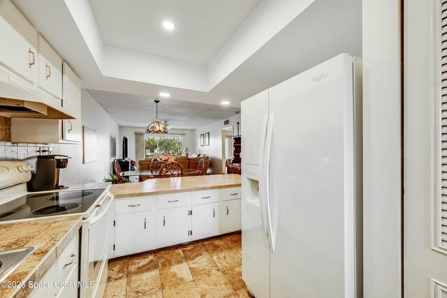 kitchen featuring white cabinets, recessed lighting, backsplash, and white appliances