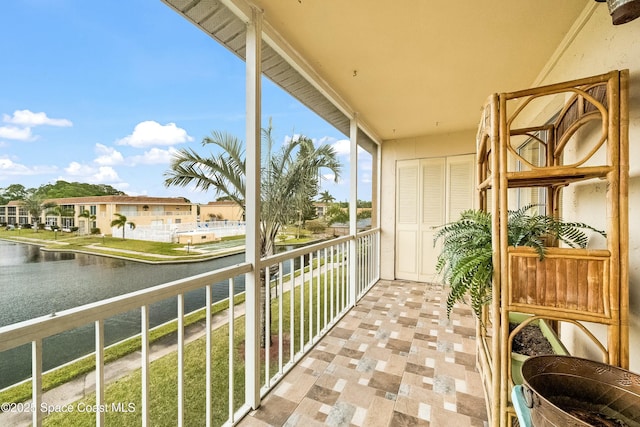 balcony featuring a water view