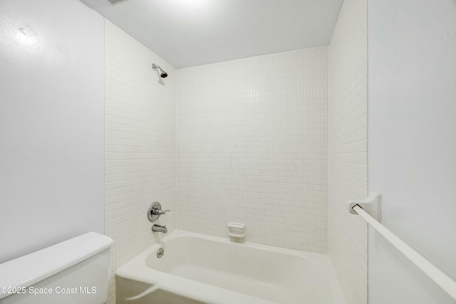 bathroom with shower / tub combination and toilet