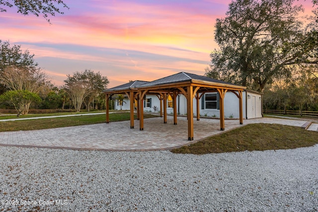 view of front facade featuring a patio area and a lawn