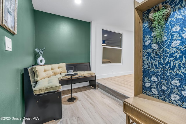 sitting room with hardwood / wood-style flooring