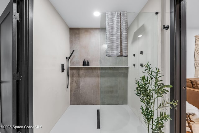 bathroom with a shower with shower door