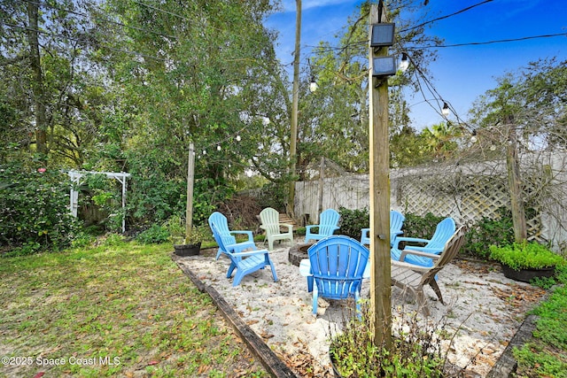 view of yard with an outdoor fire pit